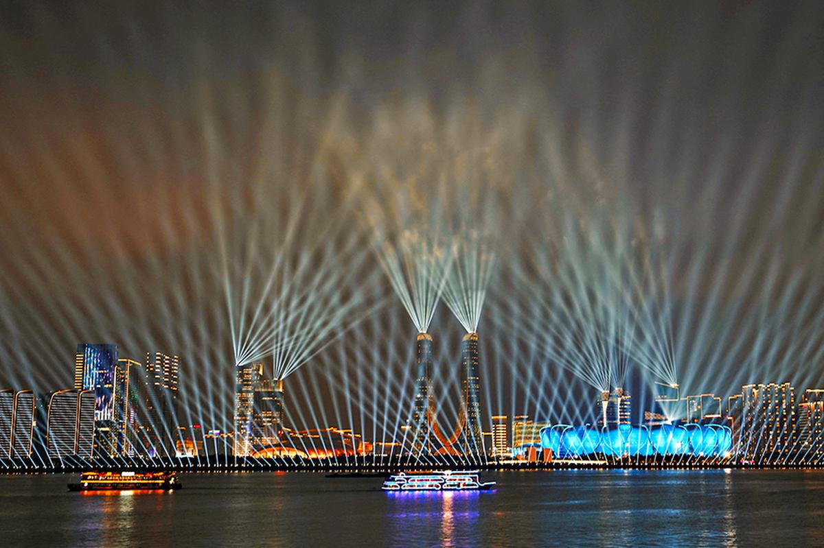 Hangzhou Olympic Sports Center Stadium, the opening ceremony venue for the 19th Asian Games Hangzhou 2022, is lit up during a light show ahead of the games in Hangzhou, Zhejiang province.