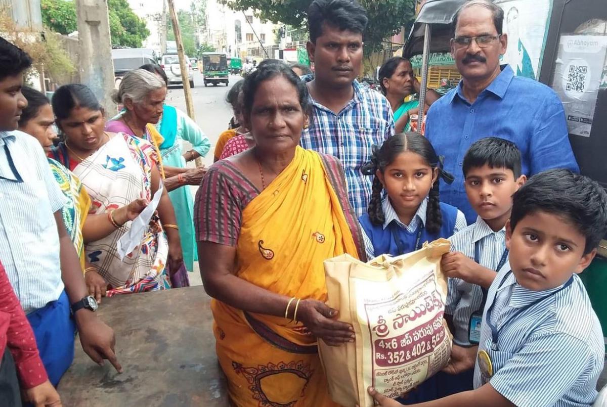 Nirmala High School students distribute rice, grocery items to slum-dwellers