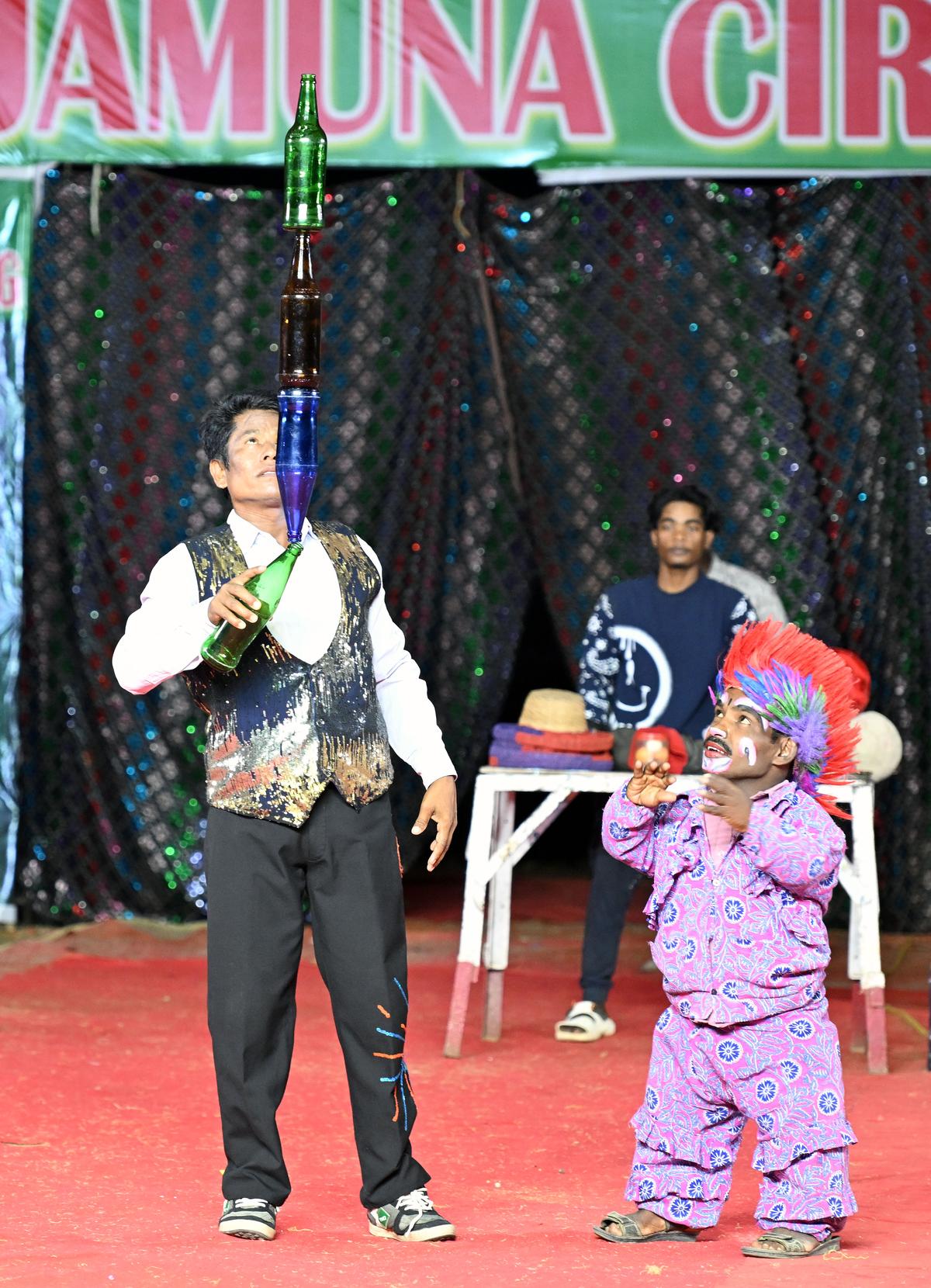 Juggler and clown perform their acts in the Jamuna Circus show at Morais City in Tiruchi.