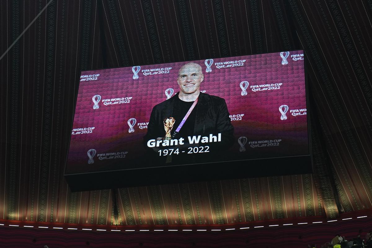 A tribute to journalist Grant Wahl is shown on a screen before the World Cup quarterfinal soccer match between England and France, at the Al Bayt Stadium in Al Khor, Qatar on December 10, 2022. 