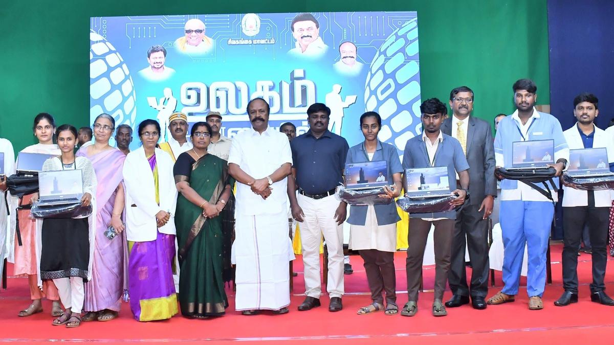 Minister distributes laptops to college students under ‘Ulagam Ungal Kaiyil’ initiative
