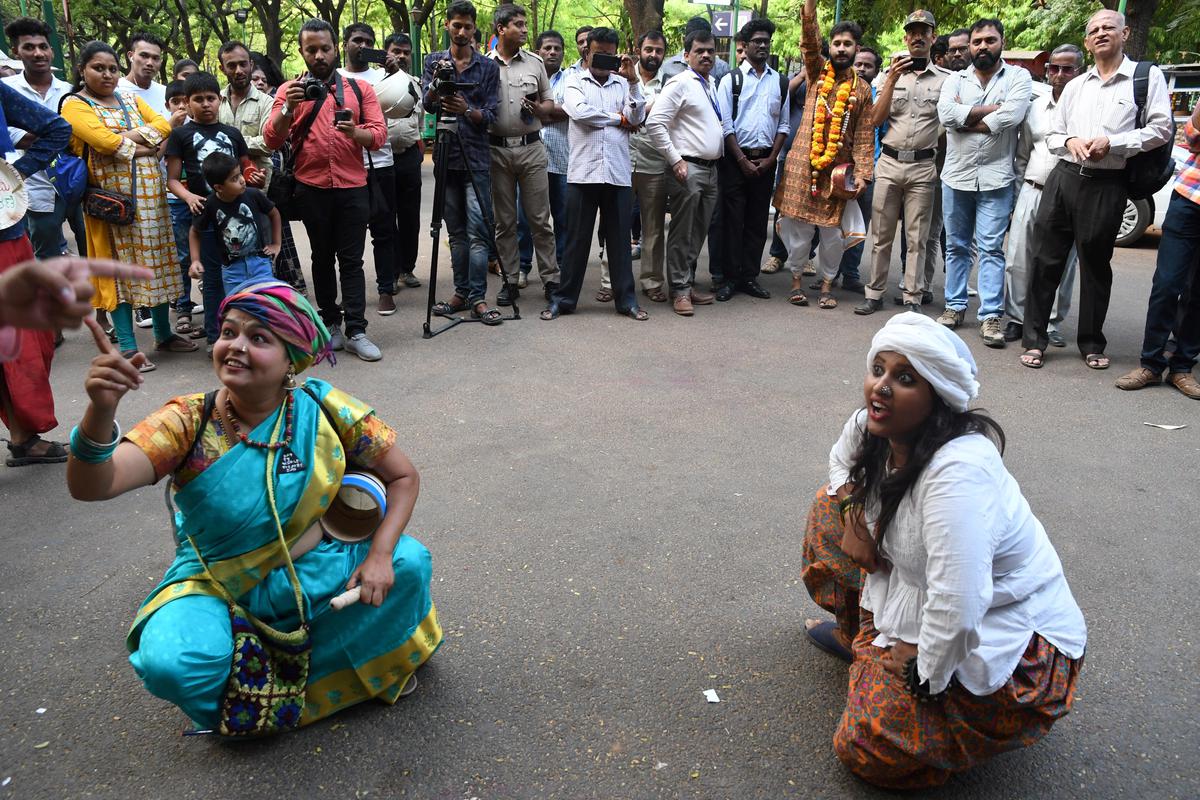     Theatre artists perform a street play to mark World Theatre Day at Cubbon Park in Bengaluru on March 27, 2019. 