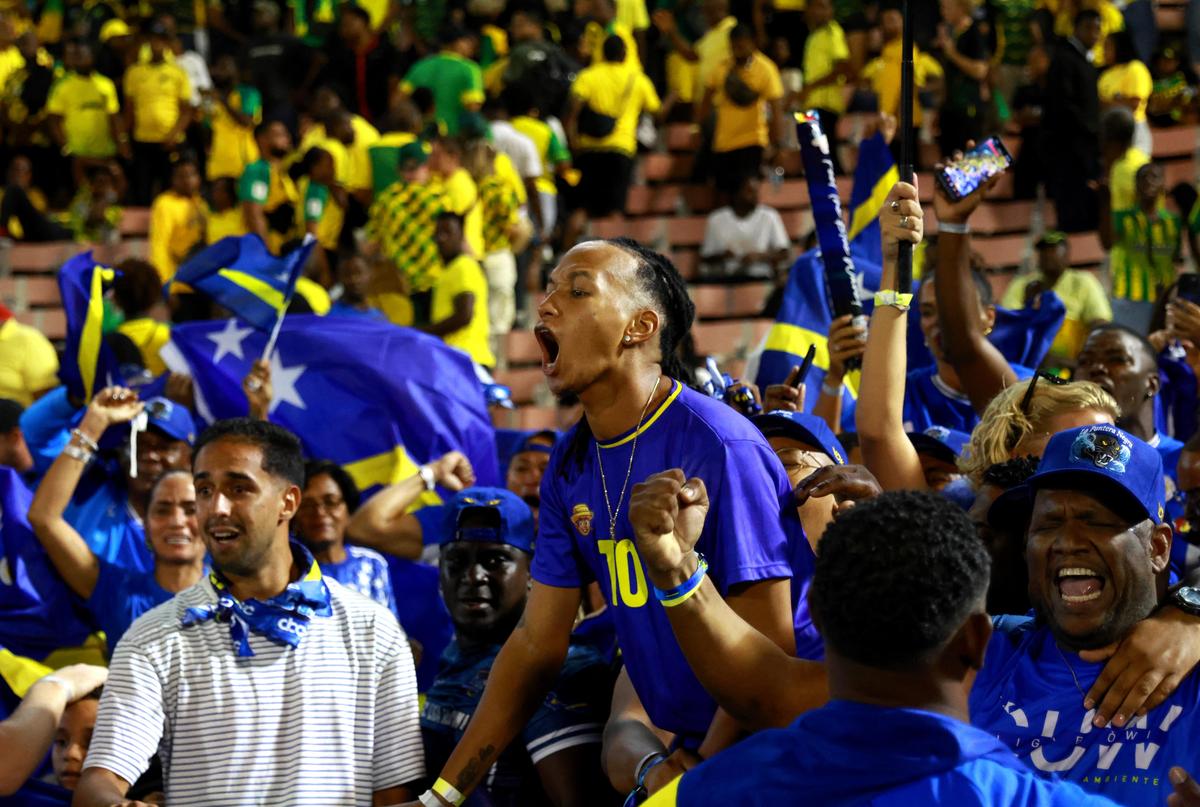 Curacao fans celebrate after they qualify for the World Cup