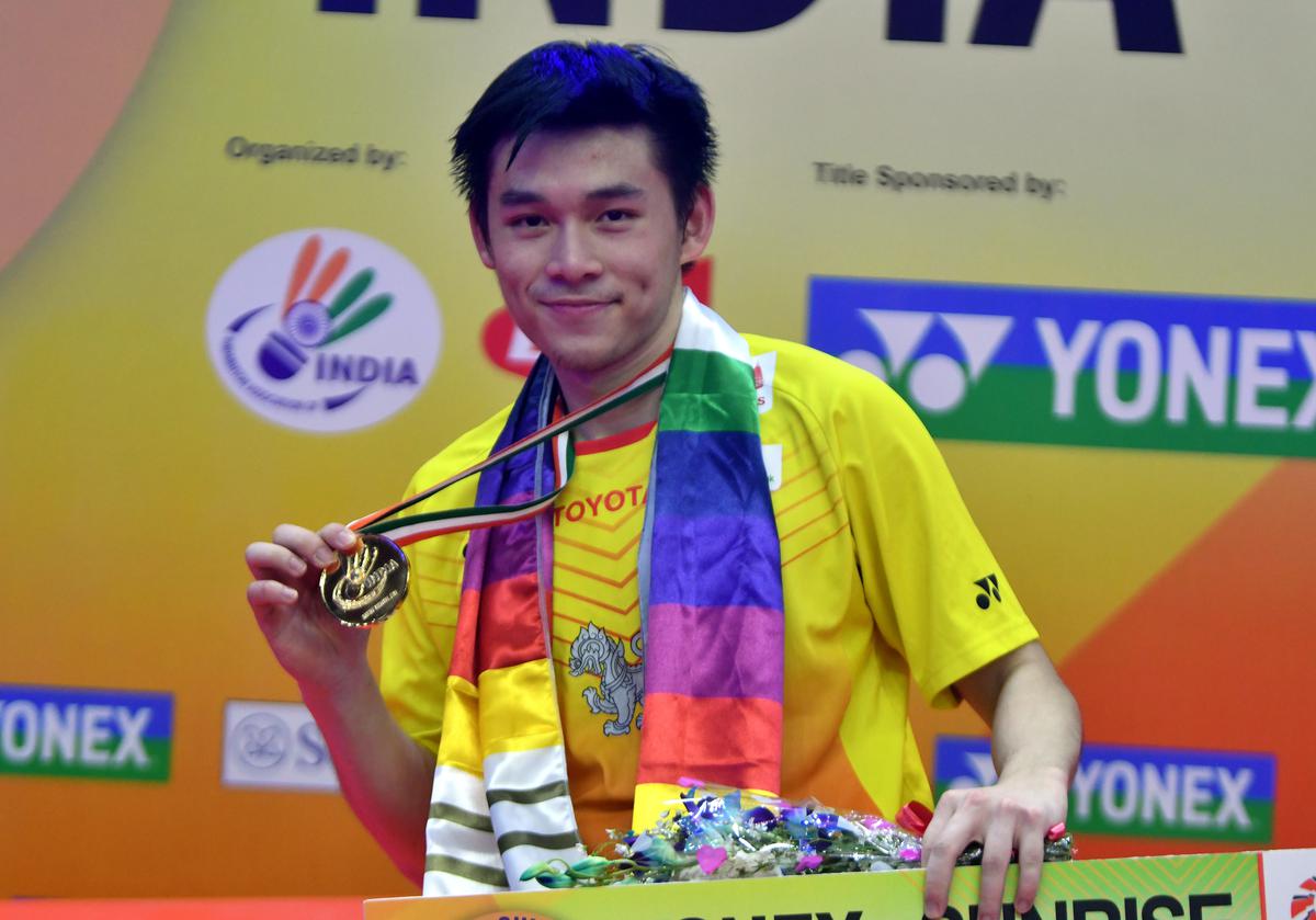 Kunlavut Vitidsarn of Thailand proudly displays his winner’s medal following his victory over Viktor Axelsen in the summit clash at the India Open badminton tournament in Delhi on Sunday. 
