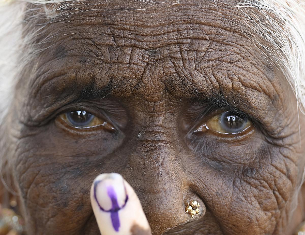 Eighty-five-year-old Ningamma showing inked finger after casting her vote at Satnur, in Bengaluru Rural  Lok Sabha constituency.  