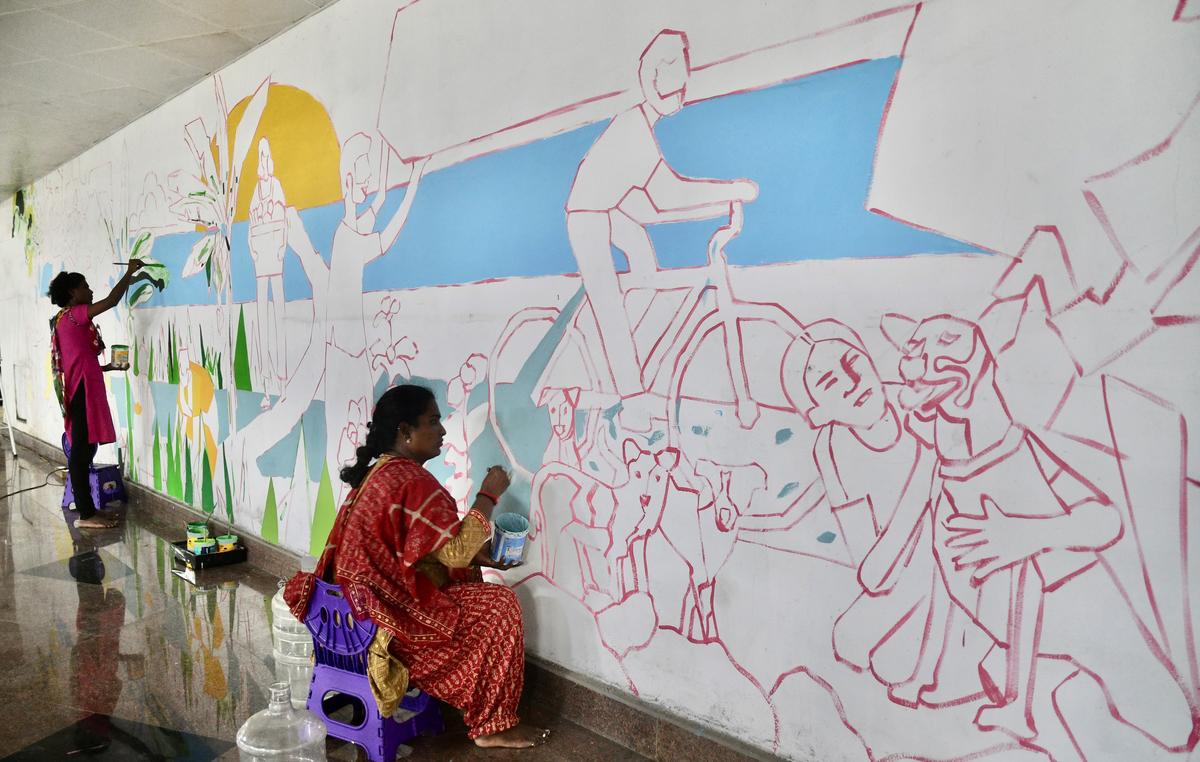 Artistic touch: This 2022 photograph shows murals being painted in the car parking area of the Chennai Central Metro Rail station.
