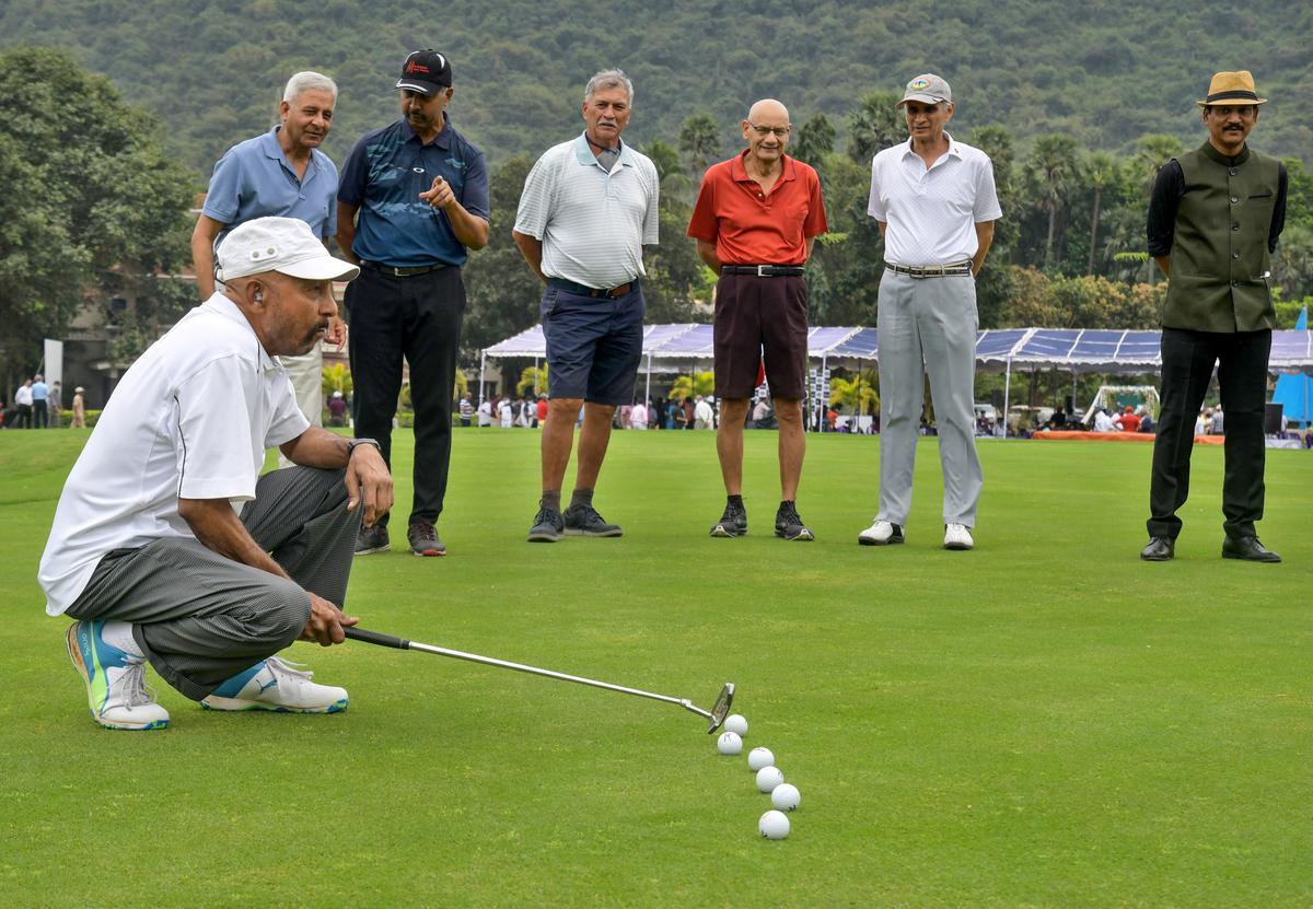 Former cricketer Syed Kirmani prepares to swing at East Point Golf Club at the renovated Championship Golf Course in Visakhapatnam