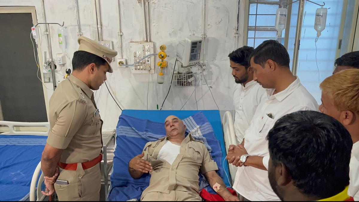 DCP Rohan Jagadeesh meets Mahadev Hukkeri, a NWKRTC conductor allegedly assaulted in Chikka Balekundri village in Belagavi district, on February 21, 2025. 