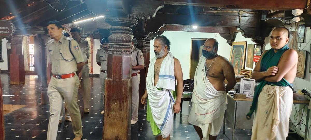 Shivamogga Superintendent of Police G.K. Mithun Kumar and other police officers visiting the Uttaradi Mutt at Mahishi in Tirthahalli taluk, following a robbery.