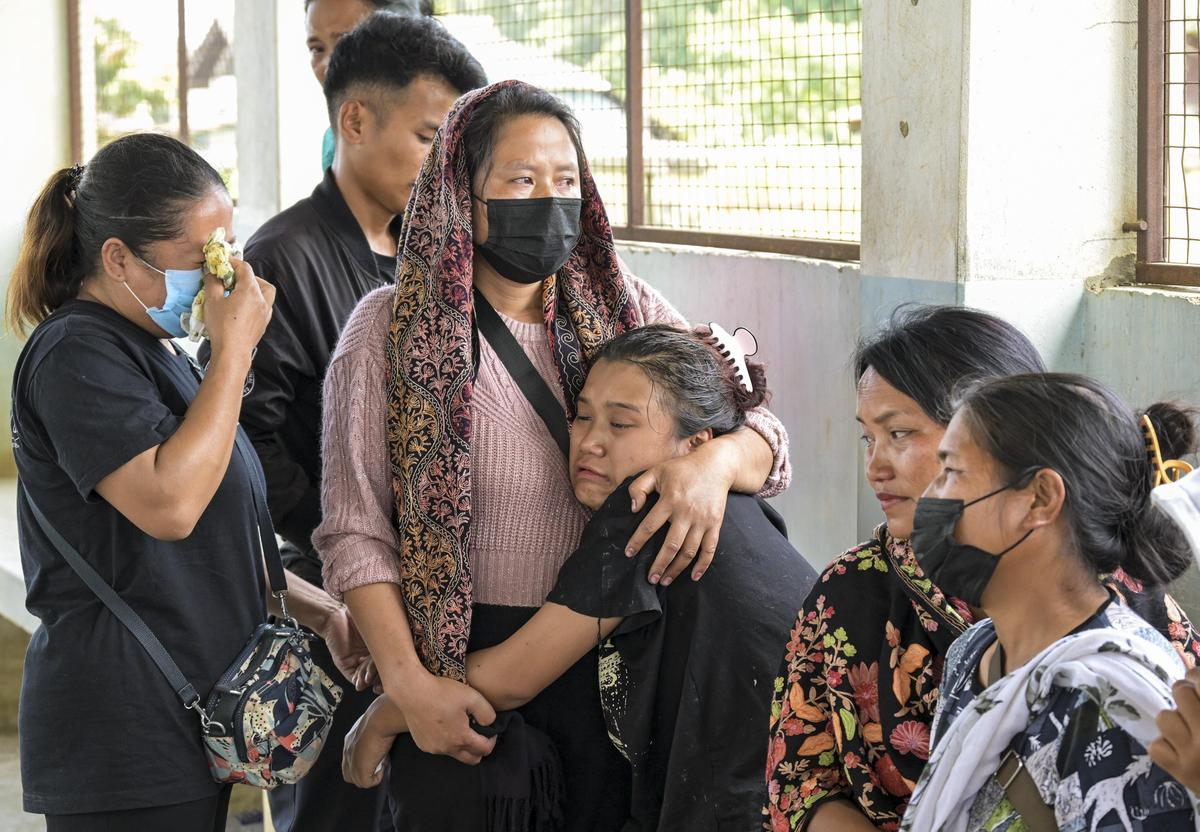 Family members of Wilson Thanga, who was killed in Manipur’s Noney district on Wednesday evening as suspected militants fired on his vehicle, mourn after his body was deposited at JNIMS mortuary for post-mortem in Imphal on Thursday, May 14, 2026.