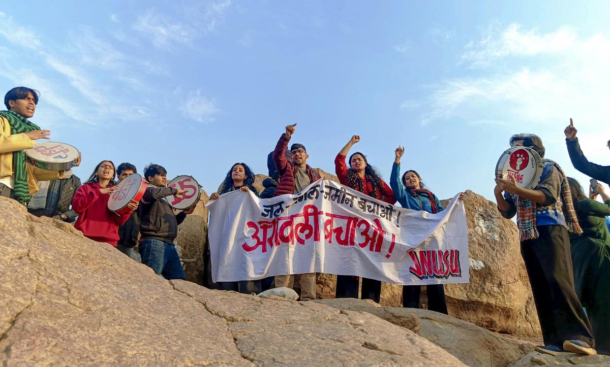 Students display banners during a protest for the protection of the Aravalli Hills at Jawaharlal Nehru University, in New Delhi, Son aturday, Dec. 27, 2025.