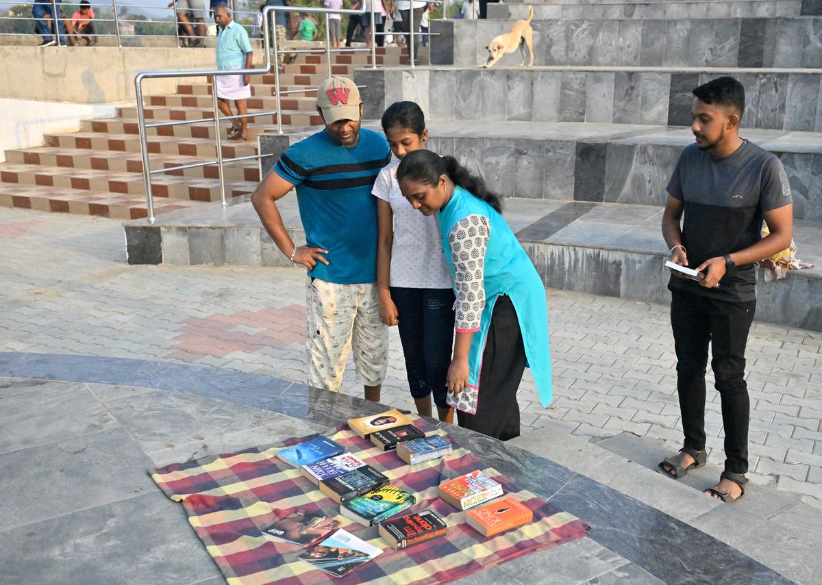 Walkers check out the books kept at the amphitheatre by Chitlapakkam lake