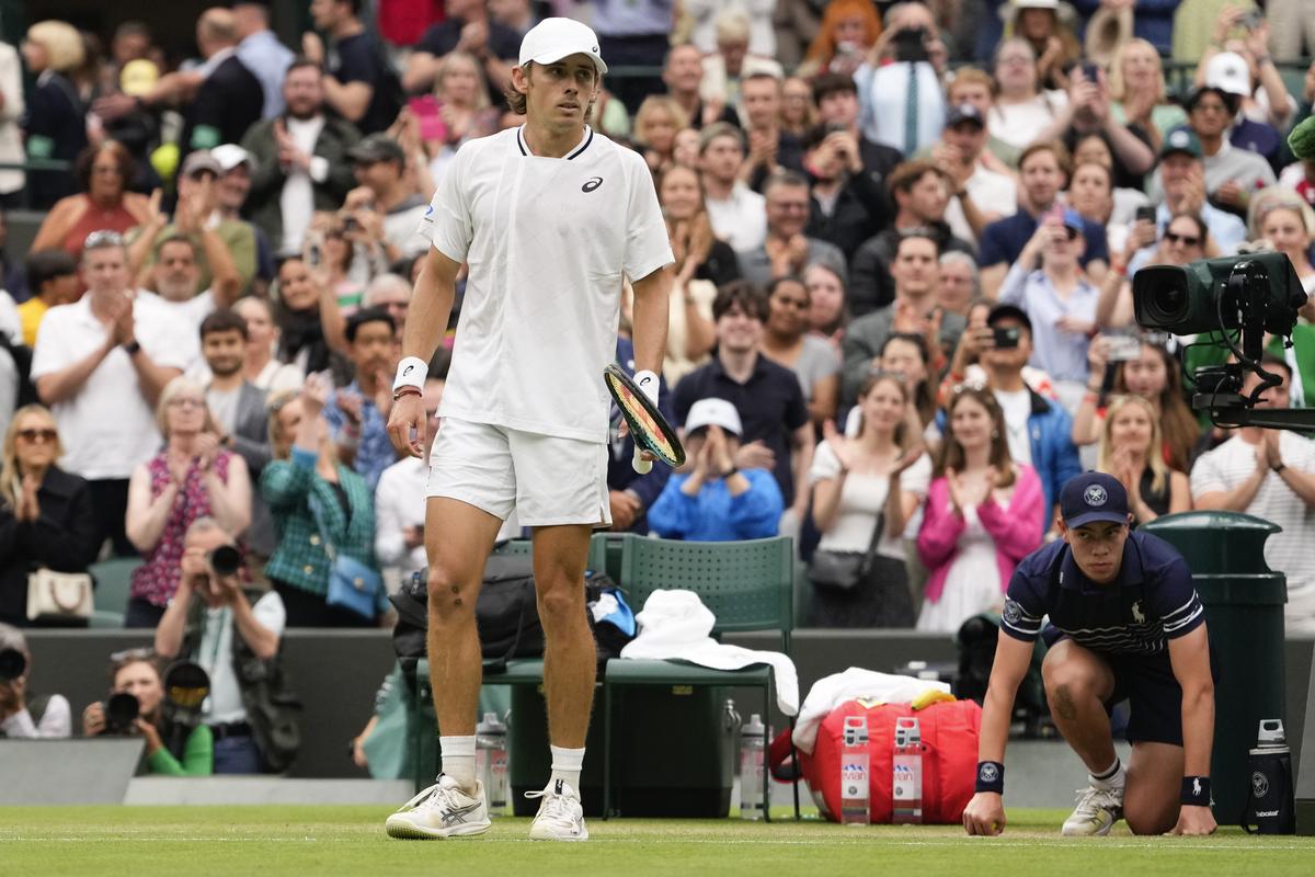 Alex de Minaur of Australia reacts following his fourth round win over Arthur Fils of France at the Wimbledon tennis championships in London, Monday, July 8, 2024. 