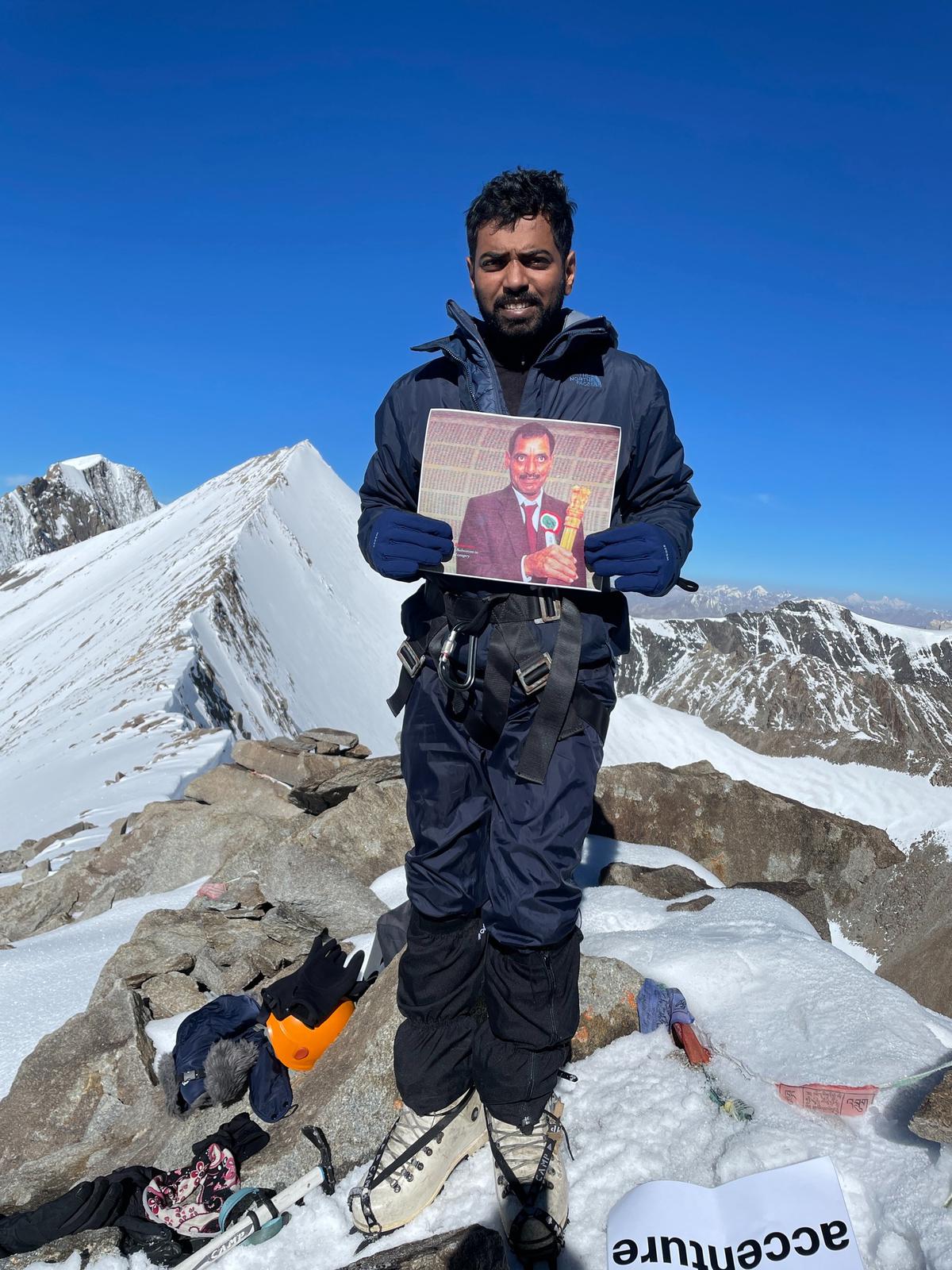 Rohith with his father’s photo Rohith with his father’s photo