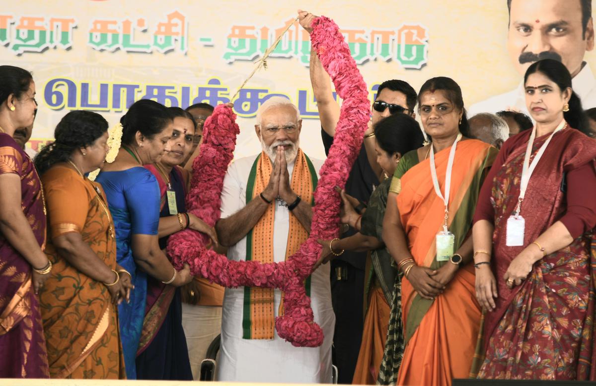 Women wing cadres of the BJP garlanding Prime Minister Narendra Modi at a public meeting in Kanyakumari district on Friday, March 15, 2024 