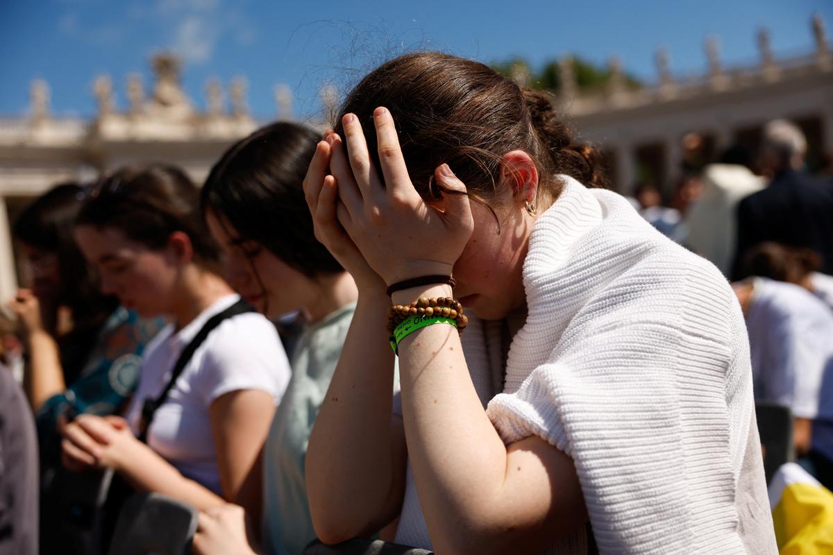 Faithful pray during the funeral Mass of Pope Francis in St. Peter’s Square at the Vatican, April 26, 2025.