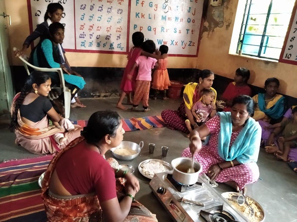 Activists of Jagruti Mahila Okkoota train women in making laddus and chikki to counter malnutrition among children in Belagavi district of Karnataka.