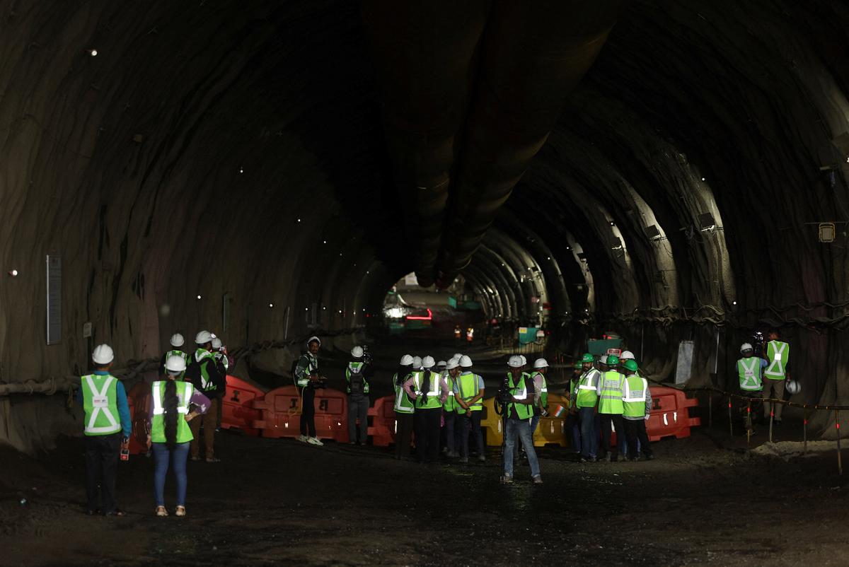 Media stand inside a tunnel completed as part of the Mumbai–Ahmedabad bullet train project in Navi Mumbai, on September 20, 2025.