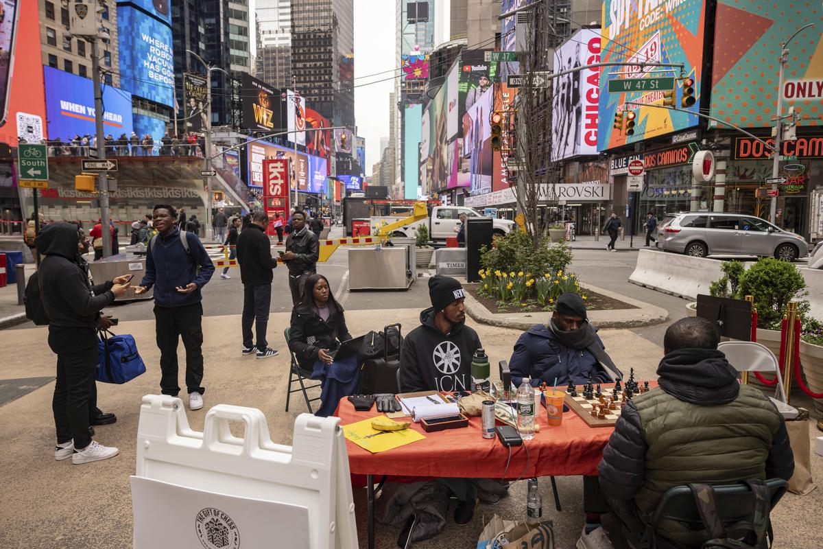 Tunde Onakoya, a Nigerian chess champion and child education advocate, plays a chess game in Times Square, in New York on April 19, 2024. Tunde Onakoya, a Nigerian chess champion and child education advocate, plays a chess game in Times Square, in New York on April 19, 2024.