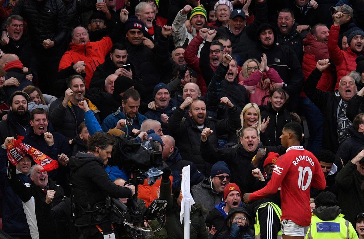 Manchester United’s English striker Marcus Rashford celebrates scoring the team’s second goal during the English Premier League football match between Manchester United and Manchester City at Old Trafford in Manchester, northwest England, on January 14, 2023. 