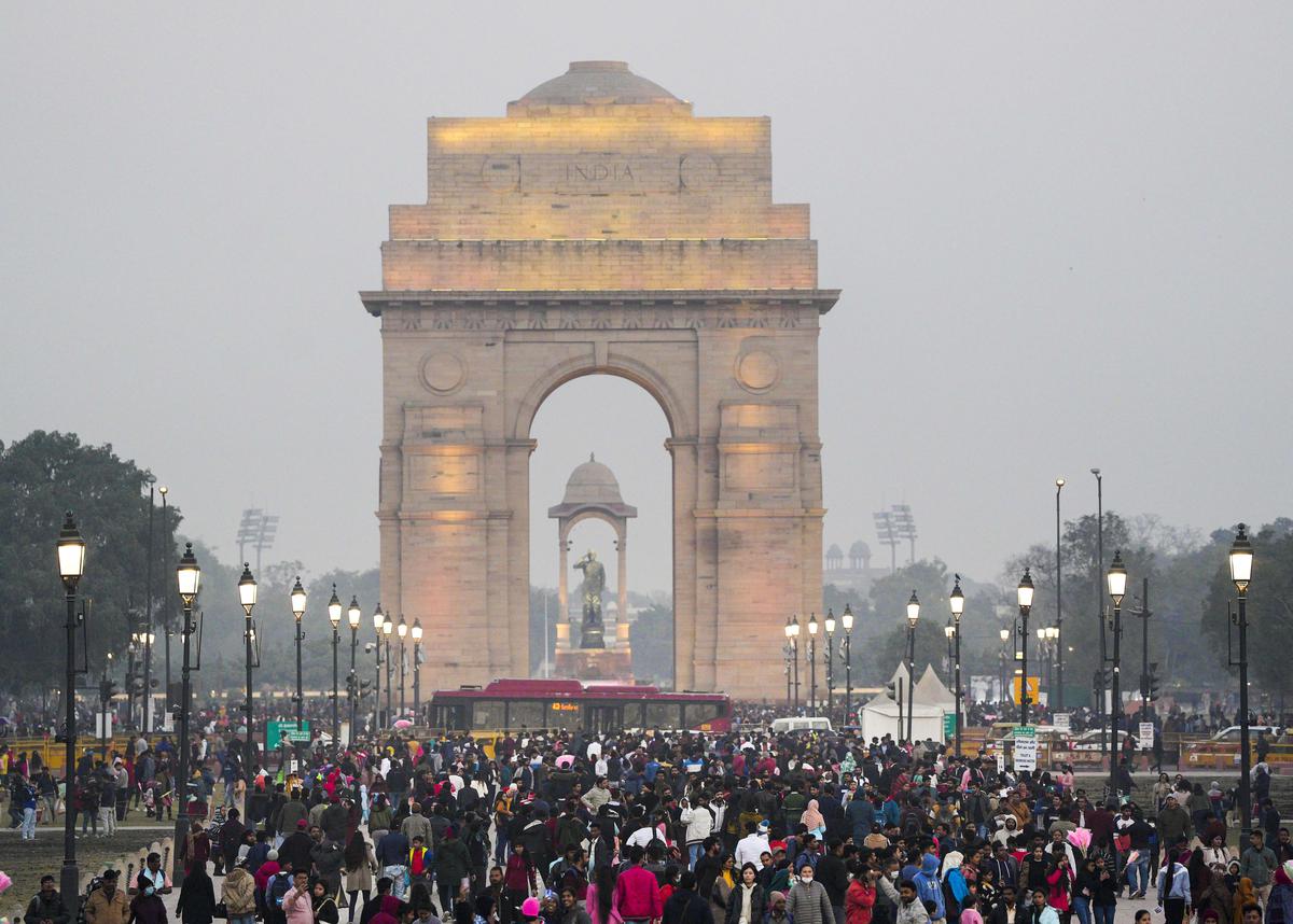 People throng India Gate for the New Year celebrations, in New Delhi on Saturday, Dec. 31, 2022. 