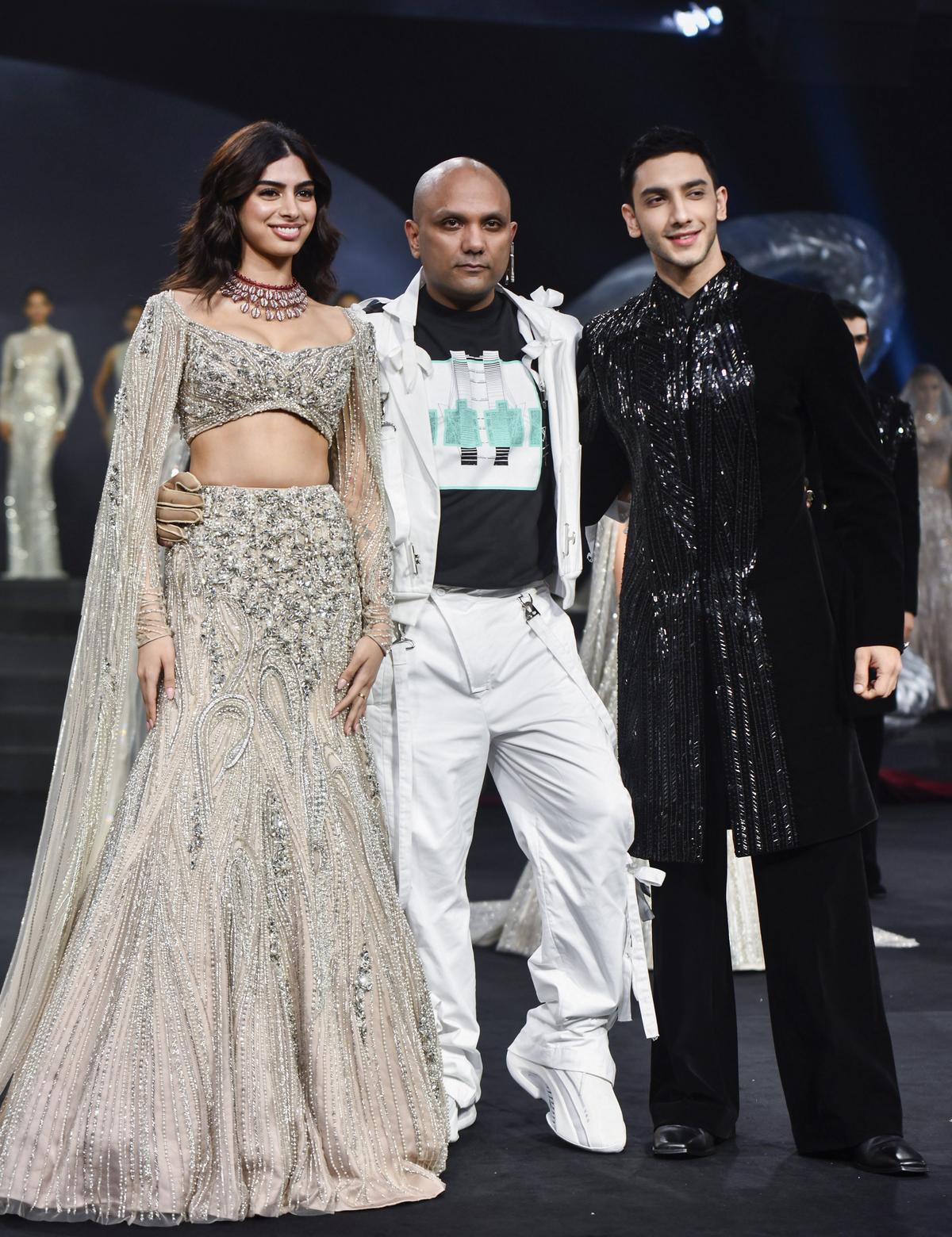 Bollywood actor Vedang Raina and actress Khushi Kapoor with designer Gaurav Gupta as they showcase his creation as the showstoppers during the Fashion Design Council of India’s (FDCI) India Couture Week 2024, in New Delhi on Monday