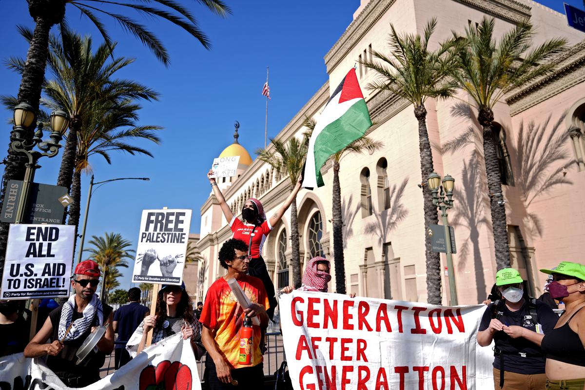 Pro-Palestinian demonstrators rally at the Shrine Auditorium where a commencement ceremony for graduates from Pomona College was being held Sunday, May 12, 2024, in Los Angeles.