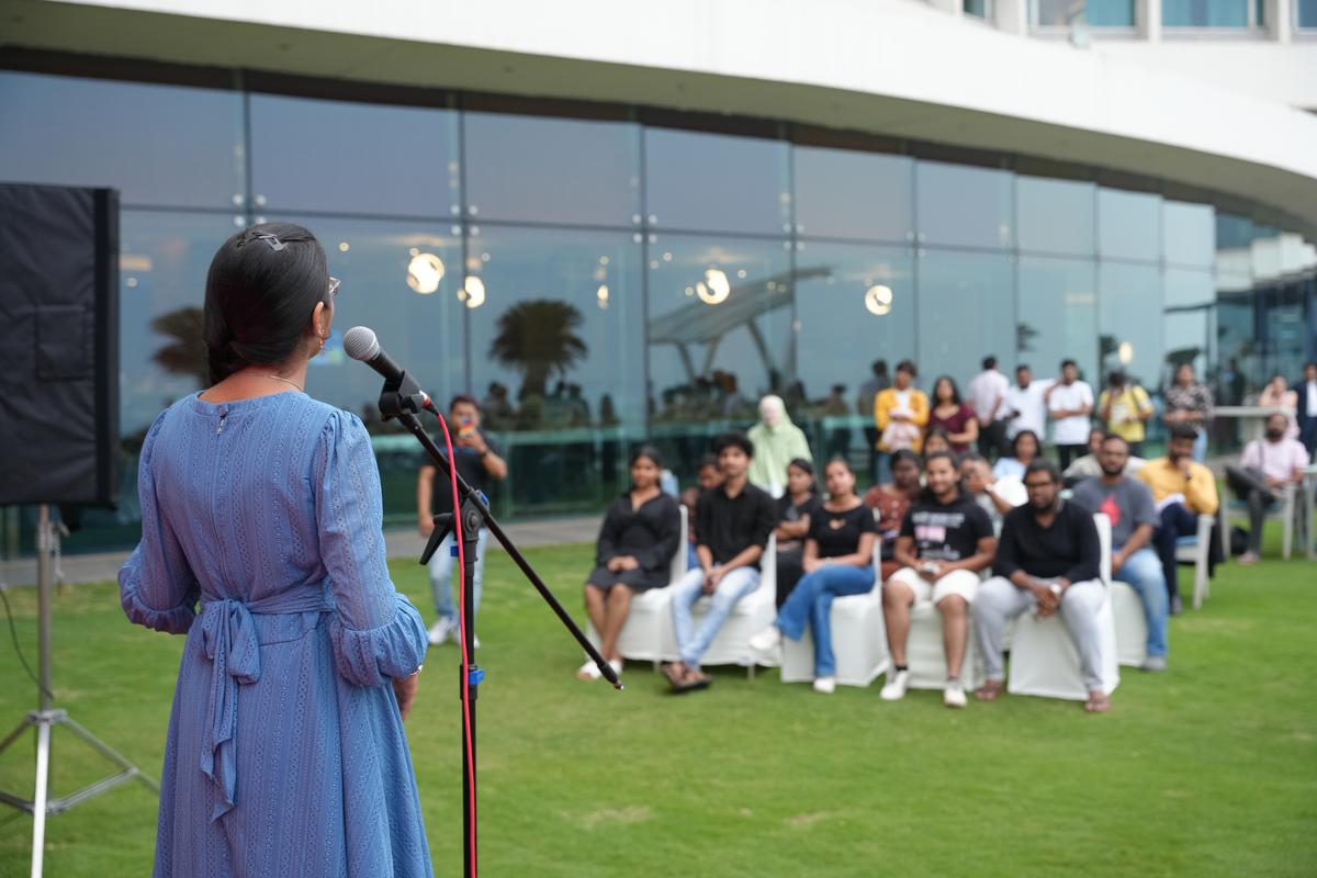 People listening to a participant during a session by Vizag Writers, a community of aspiring writers, poets and storytellers, in Visakhapatnam.