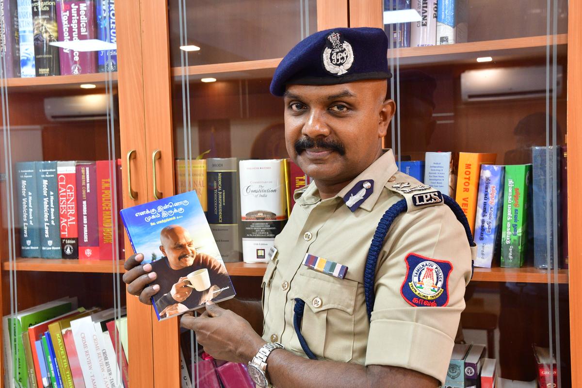 Coimbatore Tamil Nadu 21/02/2024:  Coimbatore City Police Commissioner V Balakrishnan with his book ' Enakku Innoru Mugam Irukku' in the city on Wednesday. Photo: Periasamy M/ The Hindu.