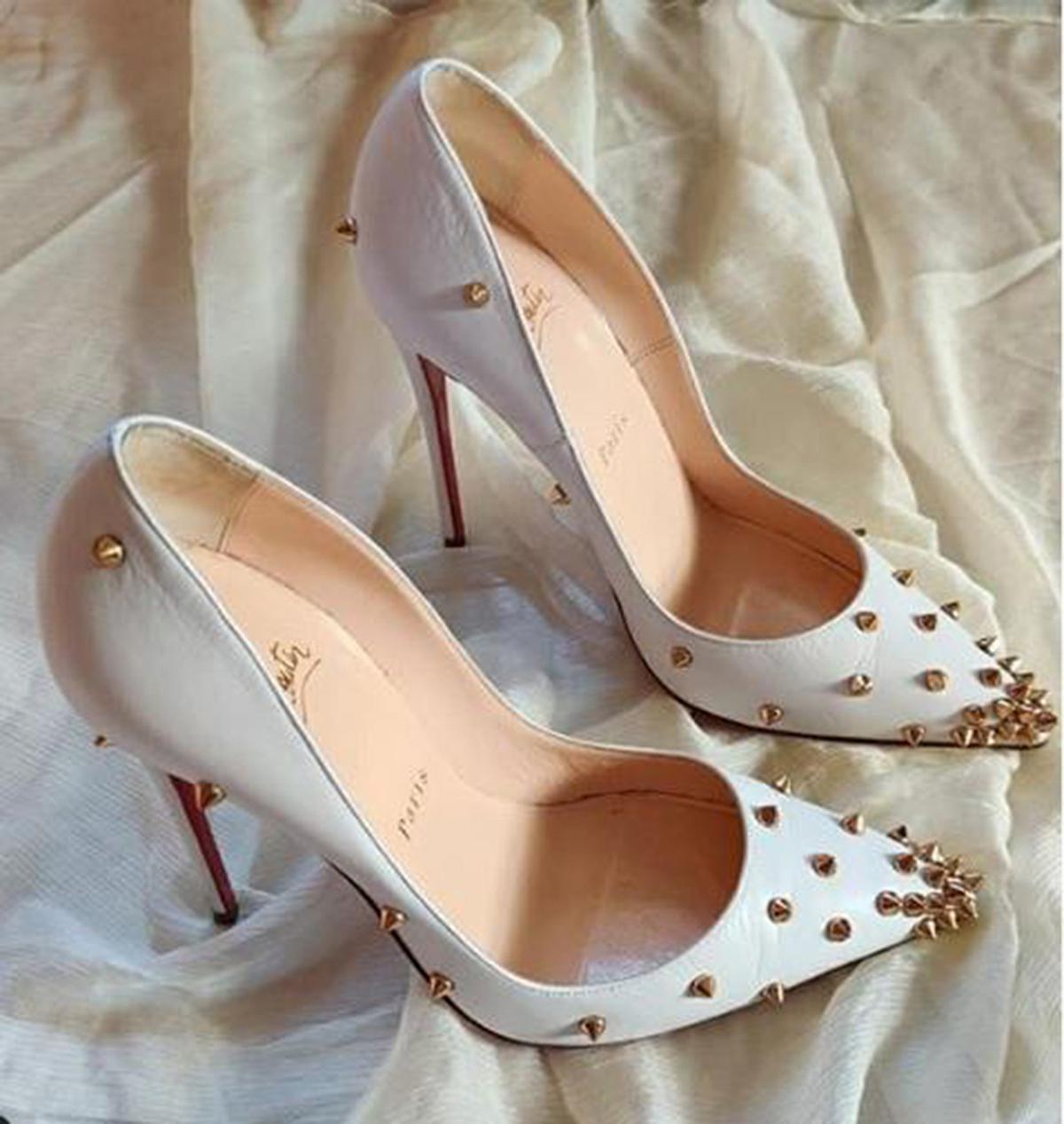 White studded Louboutins 
