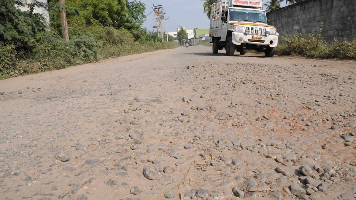 Pothole-ridden road at Vendipalayam poses threat to commuters
