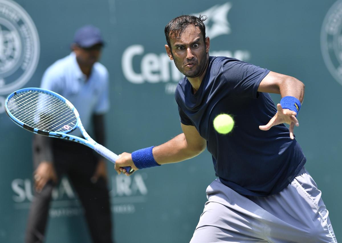 Mukund Sasikumar in action against Alastair Gray during the S.M. Krishna Memorial Open ATP Challenger tennis quarterfinal match at S.M. Krishna Tennis Stadium, Bengaluru, on May 21, 2026.