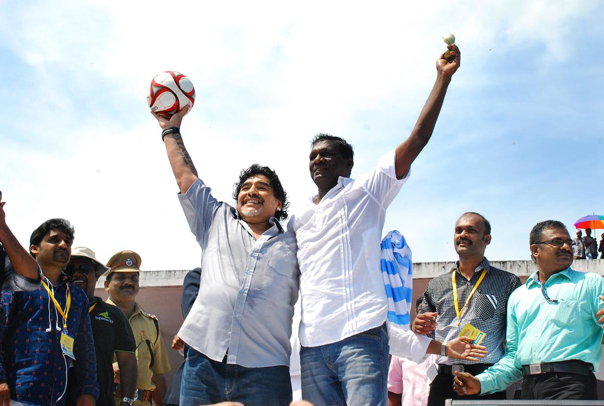 Argentine footballer Diego Maradona with former Indian football team captain I.M. Vijayan in Kannur, 2012. 