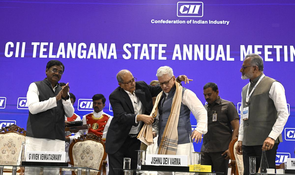 R. Sivaprasad Reddy, chairman of Confederation of Indian Industry (CII) Telangana, honouring Governor Jishnu Dev Varma during the CII Telangana State annual meeting in Hyderabad on Saturday. Also seen are Telangana Labour and Mines Minister G. Vivek Venkatswamy, and Chairman of CII Southern Region, Thomas John Muthoot.