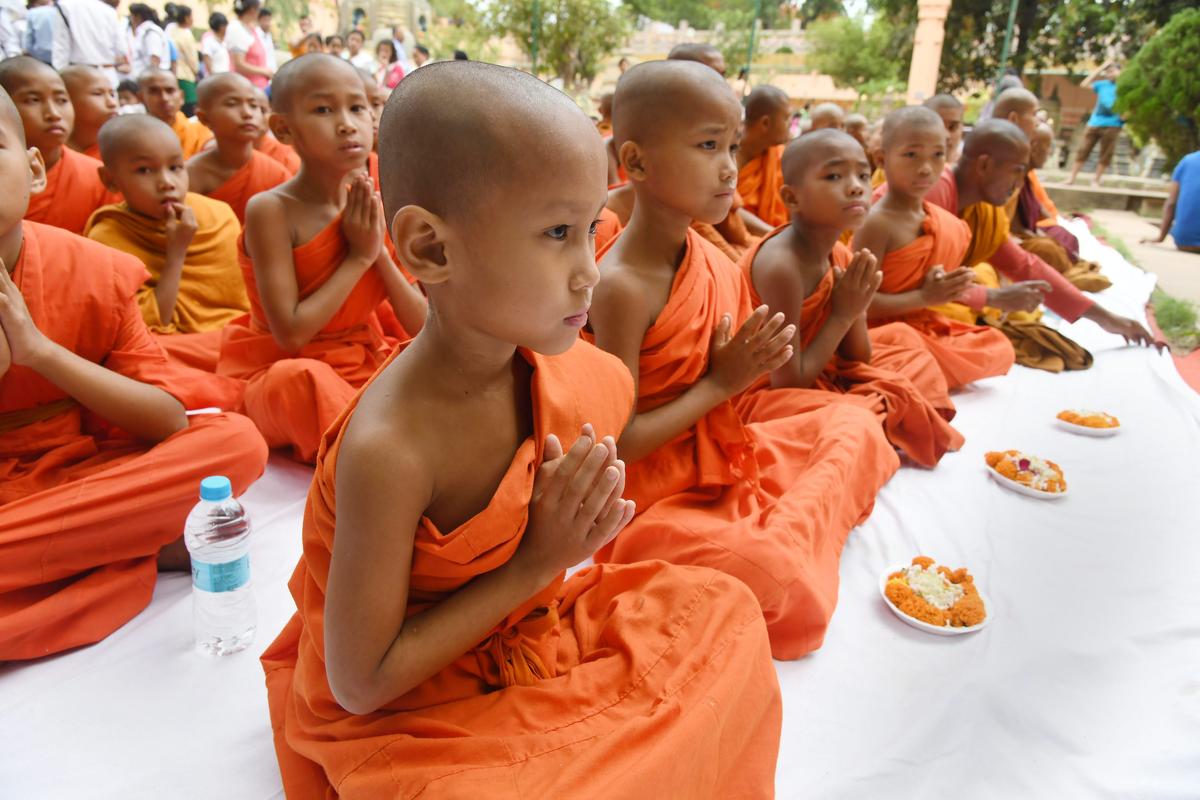 Novice monks offer prayers at the World Heritage Mahabodhi Temple in Bodh Gaya, Bihar.