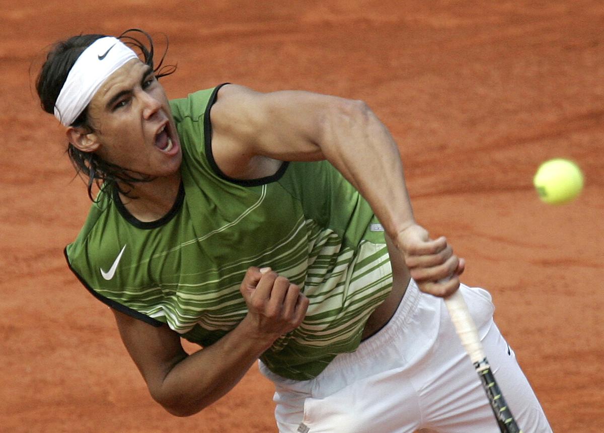 Rafael Nadal serves to Roger Federer during their semifinal match of the French Open in June, 2005