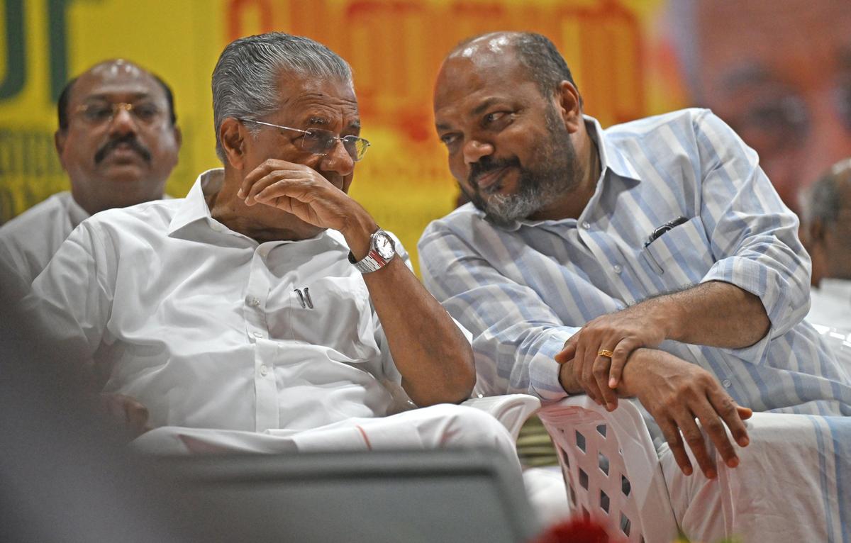 Chief Minister Pinarayi Vijayan interacting with Industries Minister P. Rajeeve at the LDF election convention in the city on December 5.