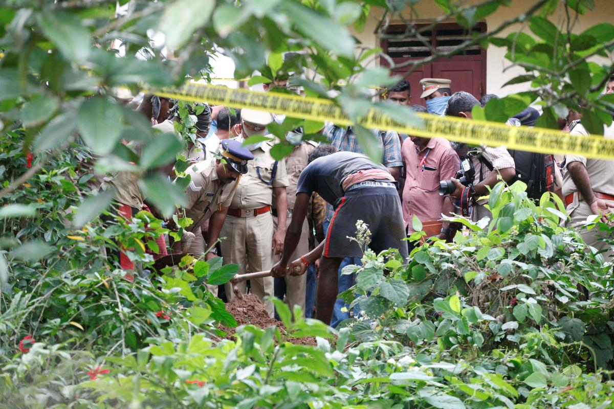 The police exhume the mutilated body parts at the house in Elanthoor village.