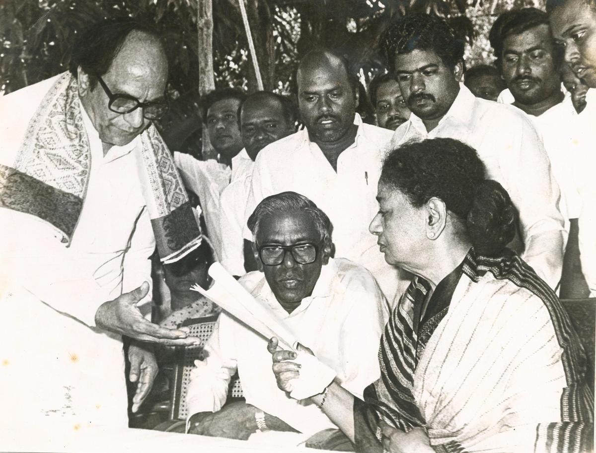 Janaki Ramachandran handing over to P.U. Shanmugham, then Health Minister, a statement announcing her decision to become the Chief Minister, on December 31, 1987. Also seen is R.M. Veerappan (seated on her right), Local Administration Minister. Janaki Ramachandran handing over to P.U. Shanmugham, then Health Minister, a statement announcing her decision to become the Chief Minister, on December 31, 1987. Also seen is R.M. Veerappan (seated on her right), Local Administration Minister.