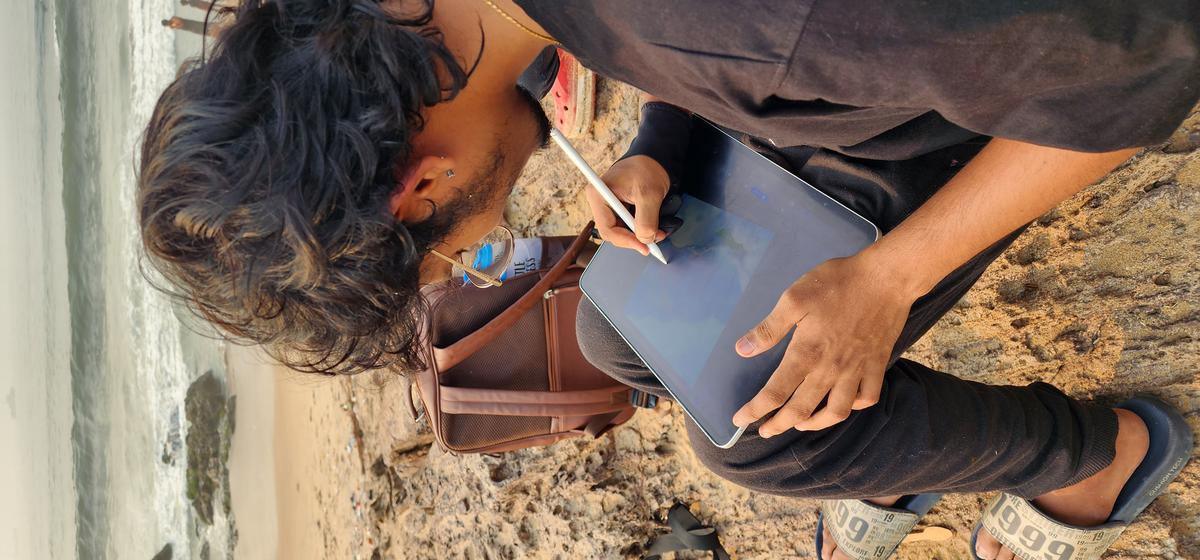 
A digital artist, who is a part of Vizag Urban Sketchers, during a meet-up at Tenneti Park in Visakhapatnam. 