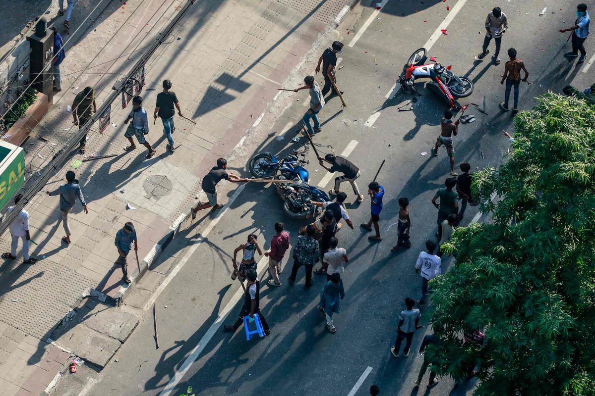 Protesters vandalize vehicles during the ongoing anti-quota protest in Dhaka on July 18, 2024. 