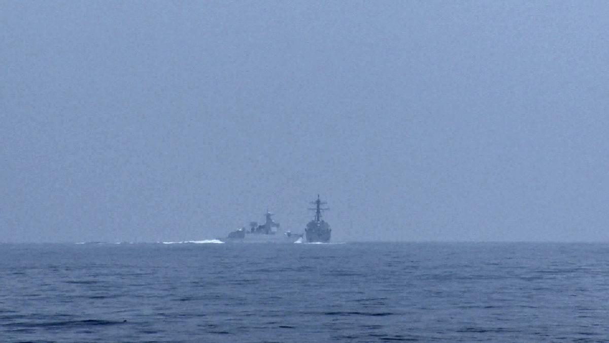 A People’s Republic of China (PRC) warship, identified by the U.S. Indo-Pacific Command as PRC LY 132, crosses the path of U.S. Navy destroyer USS Chung-Hoon as it was transiting the Taiwan Strait with the Royal Canadian Navy frigate HMCS Montreal on June 3, 2023, in a still image from video. Photo: Global News via Reuters. 