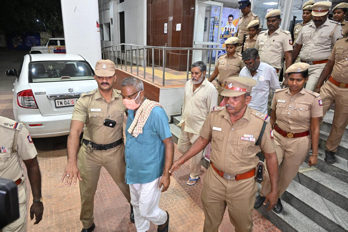 Members of Bawaria gang are being escorted by the police to a Sessions Court in Singaravelar Maligai.