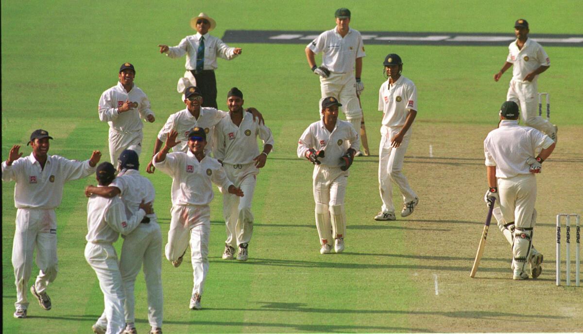 The agile Ramesh caught Warne off Harbhajan to trigger celebrations as it was the first hat-trick by an Indian in Tests. File