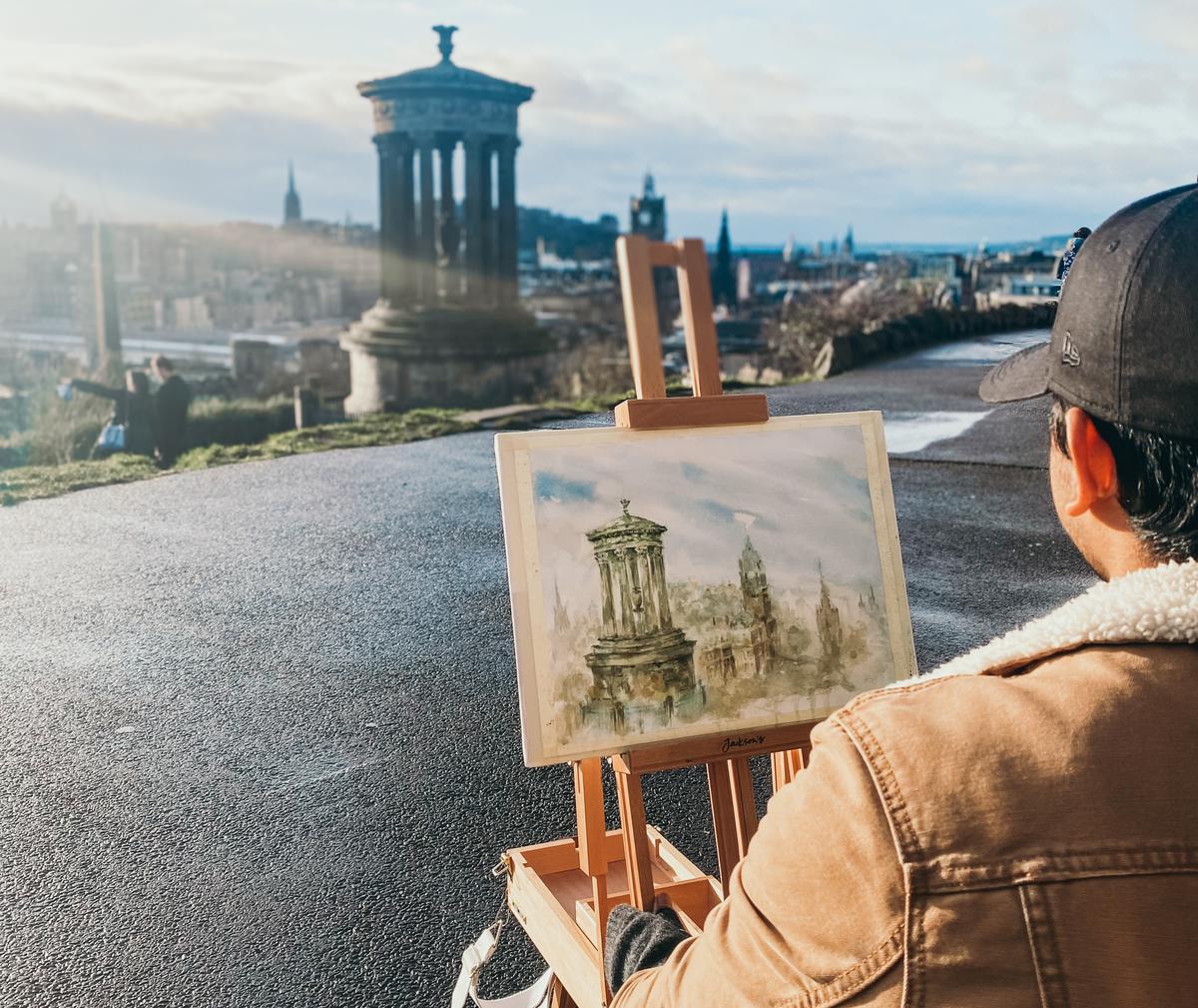 Praveen KR painting the Dugald Stewart Monument in Scotland