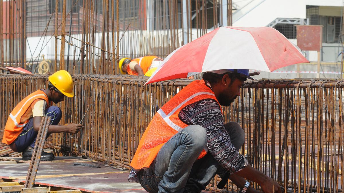 Construction labourers toil under scorching heat in Bengaluru