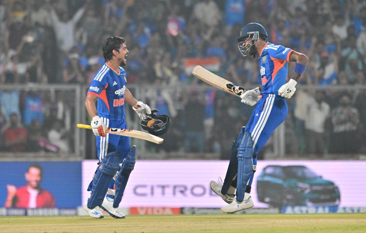 India's Ishan Kishan celebrates with Hardik Pandya after scoring a century in Thiruvananthapuram.