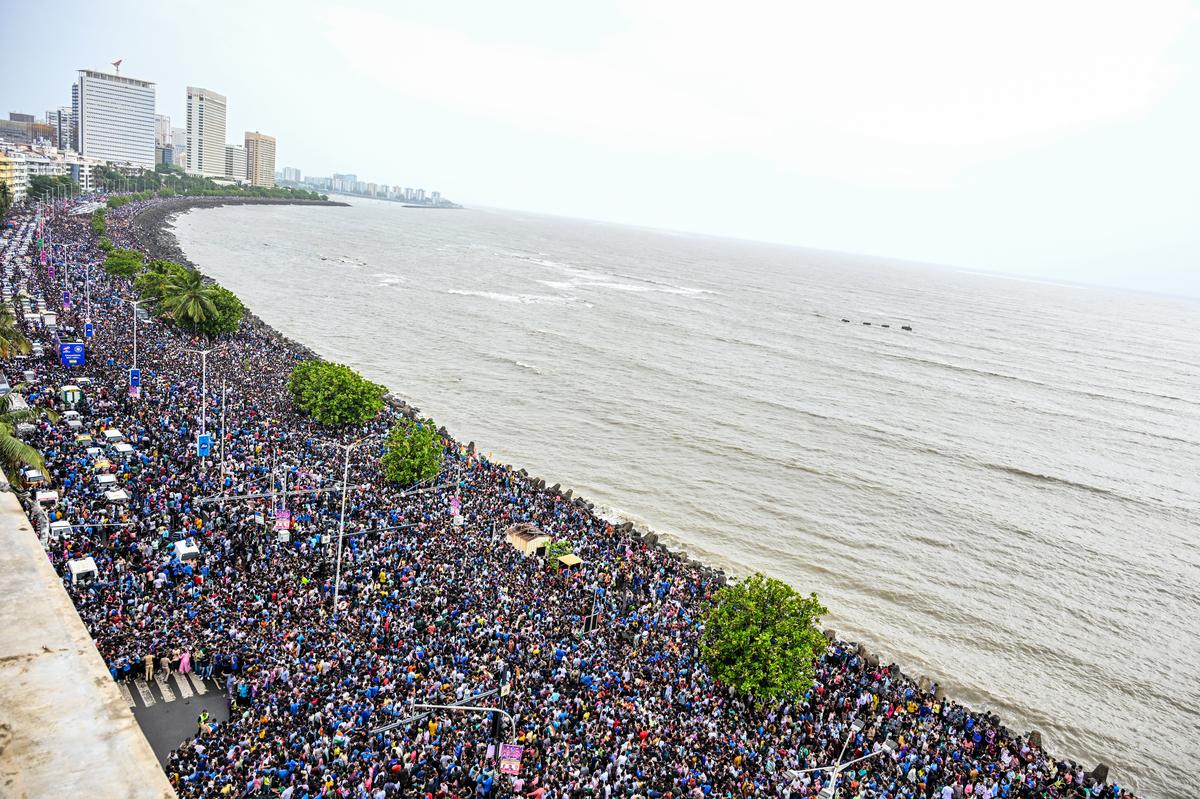 Massive crowd waits for Team India’s arrival near Wankhede Stadium at Marine Drive in Mumbai.  