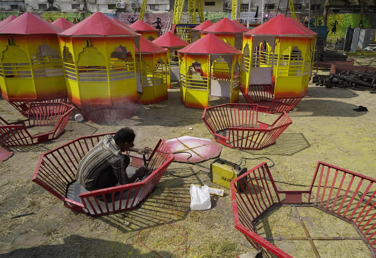 Preparations underway at the Nampally Exhibition Grounds ahead of the upcoming Numaish 2026, with workers setting up temporary structures and infrastructure in Hyderabad on Wednesday. 