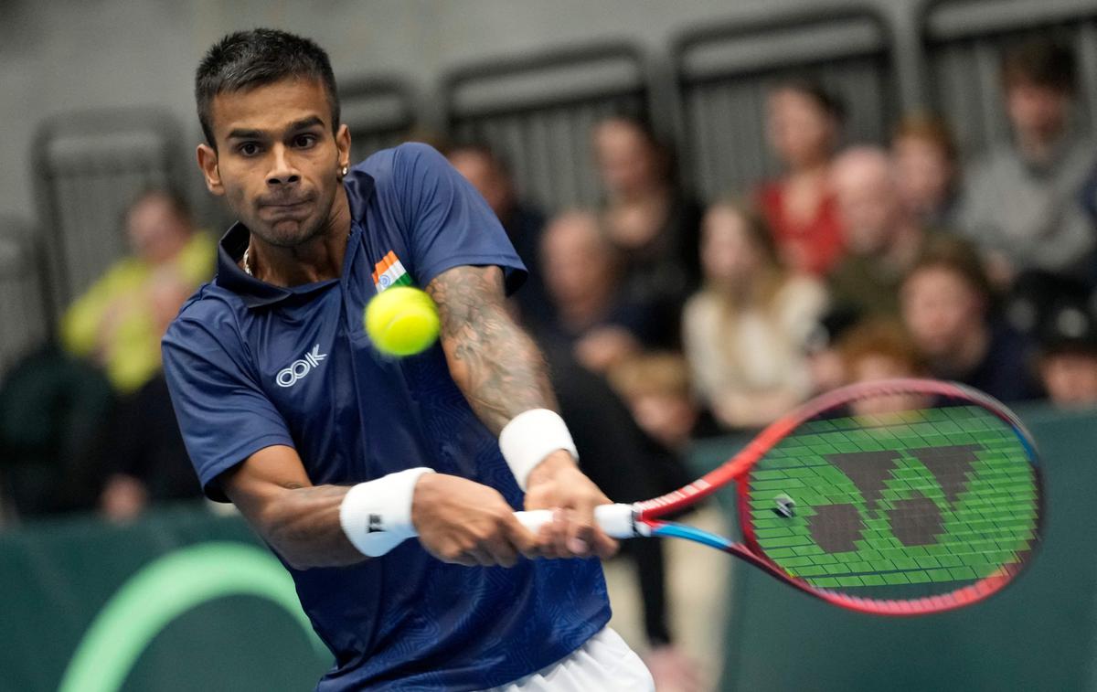 India’s Sumit Nagal returns the ball to Denmark’s Holger Rune during their tennis match of the Davis Cup World Group I Play-Offs First Round in Hilleroed, Denmark, on February 4, 2023. 
